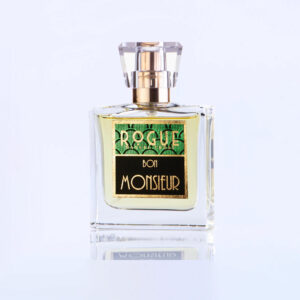 Perfume líquido dorado, tapa y frasco transparente. Etiqueta Verde con negro y letras doradas.